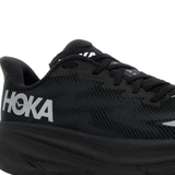Close up of the black sneakers, showing texture of the mesh