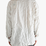 White shirts worn by a person, showing the shirts fit