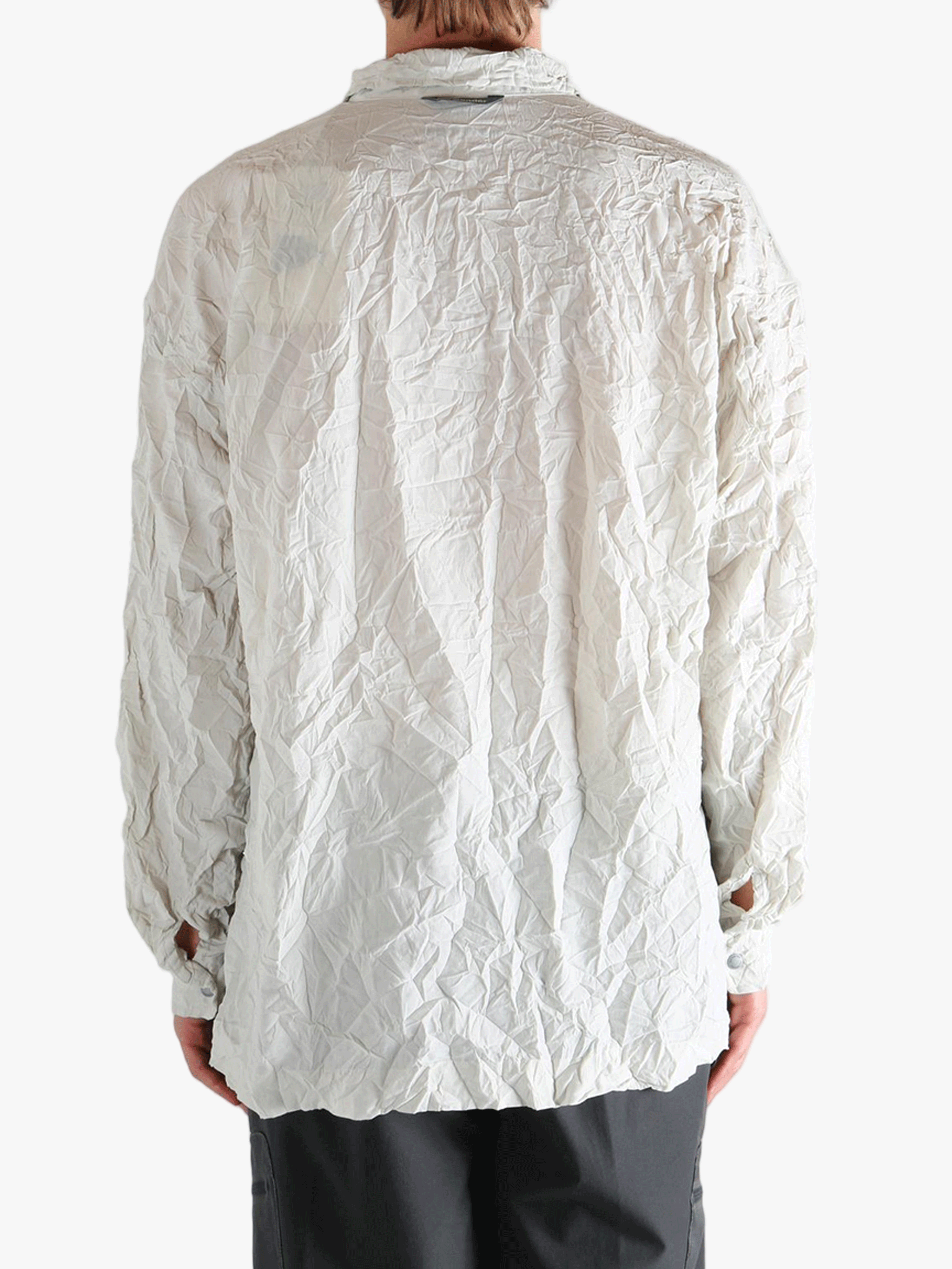 White shirts worn by a person, showing the shirts fit