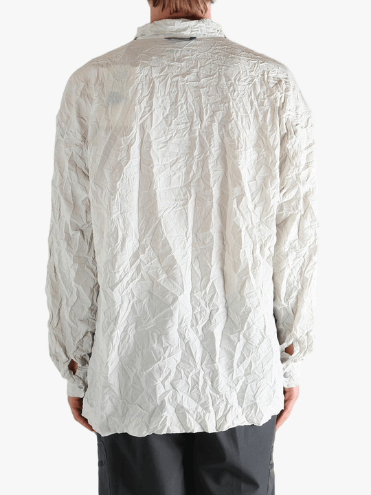 White shirts worn by a person, showing the shirts fit