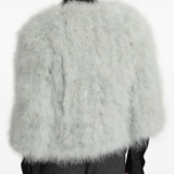 Grey coat worn by a person, showing the coat fit