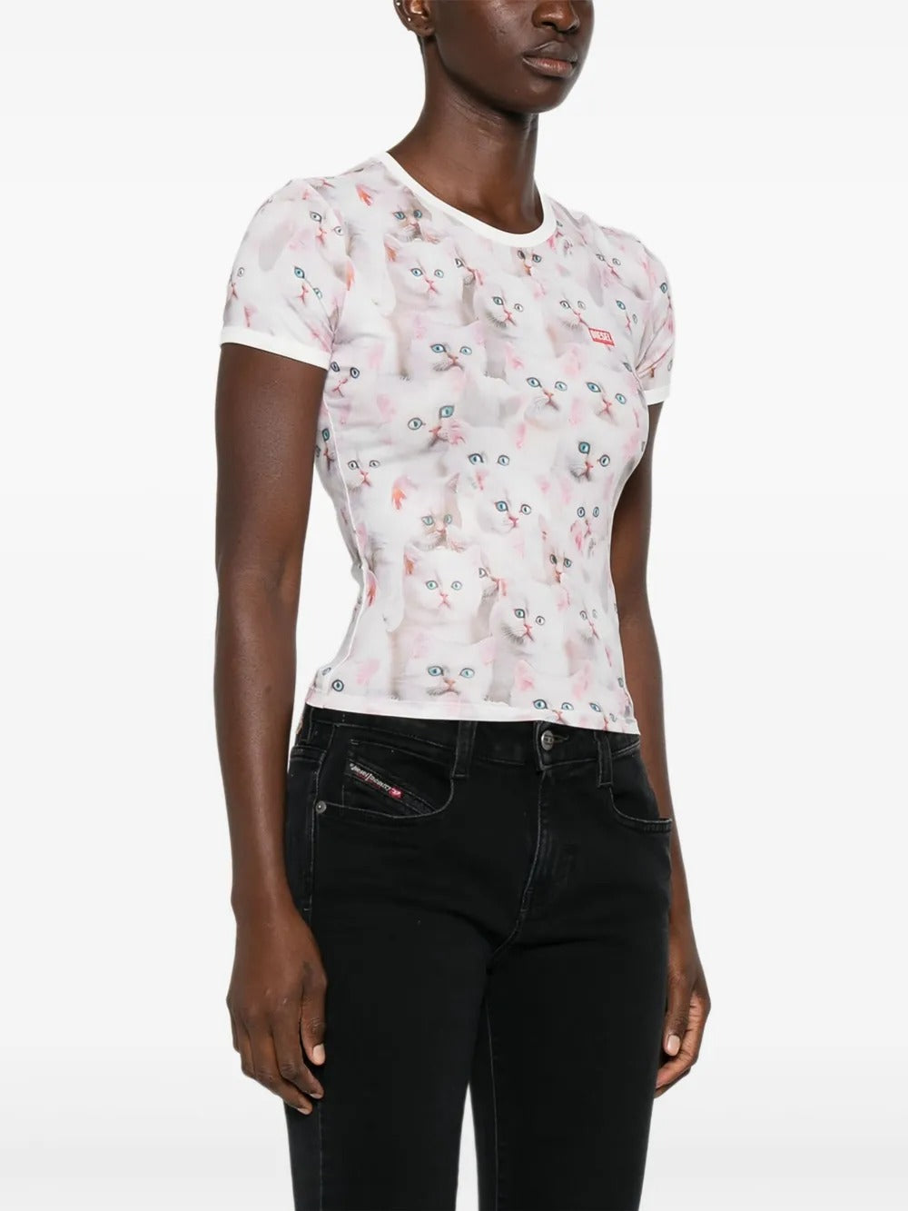 White t-shirt worn by a person, showing the shirt's fit