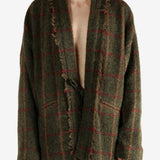 Green jacket worn by a person, showing the jacket's fit