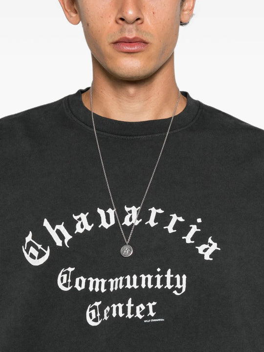 Black t-shirt worn by a person, showing the t-shirt fit