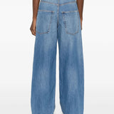 Blue jeans worn by a person, showing the jeans' fit