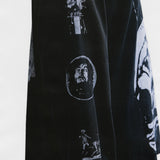 Black shirts worn by a person, showing the shirts fit