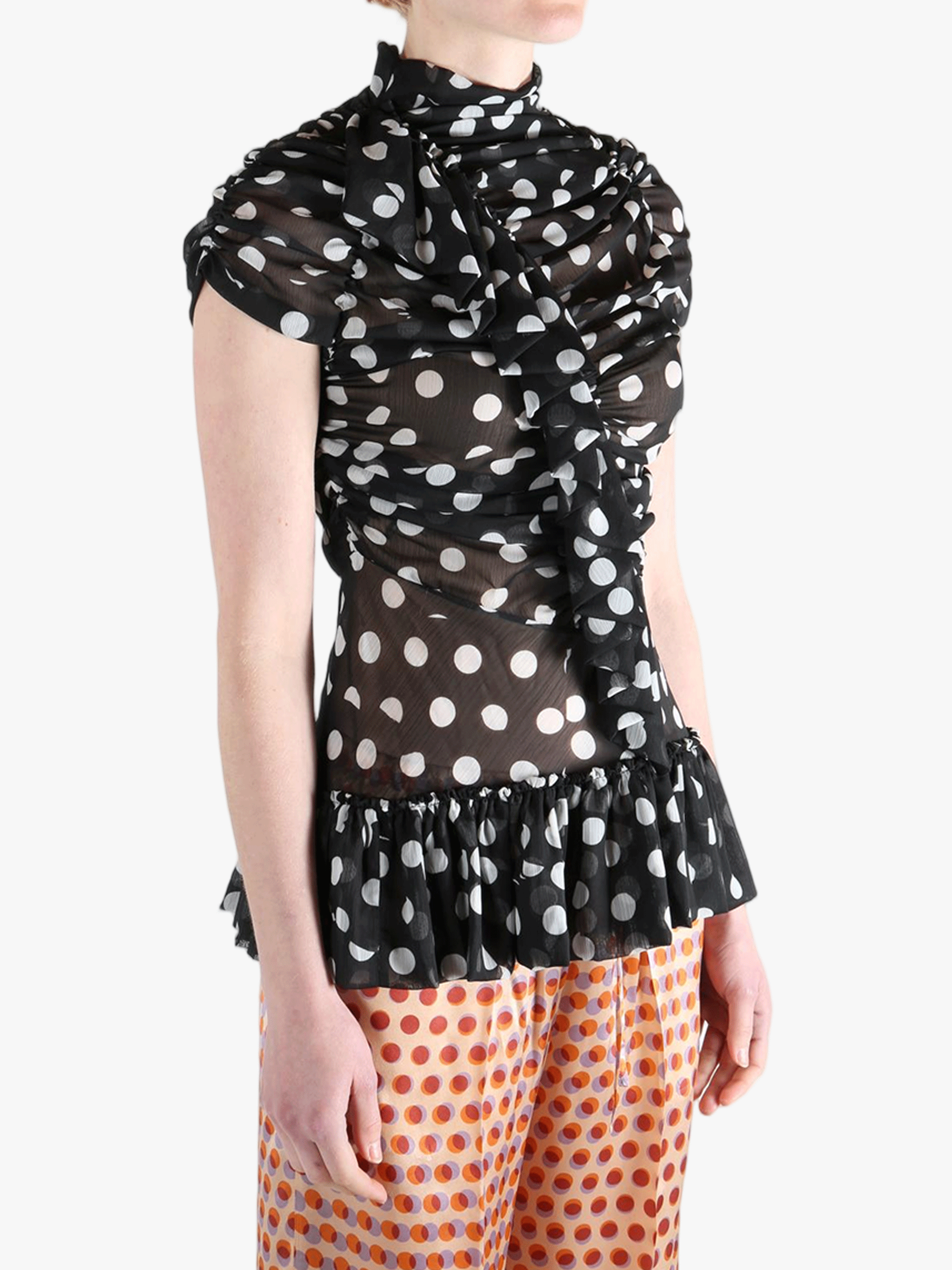 Black top worn by a person, showing the top‘s fit