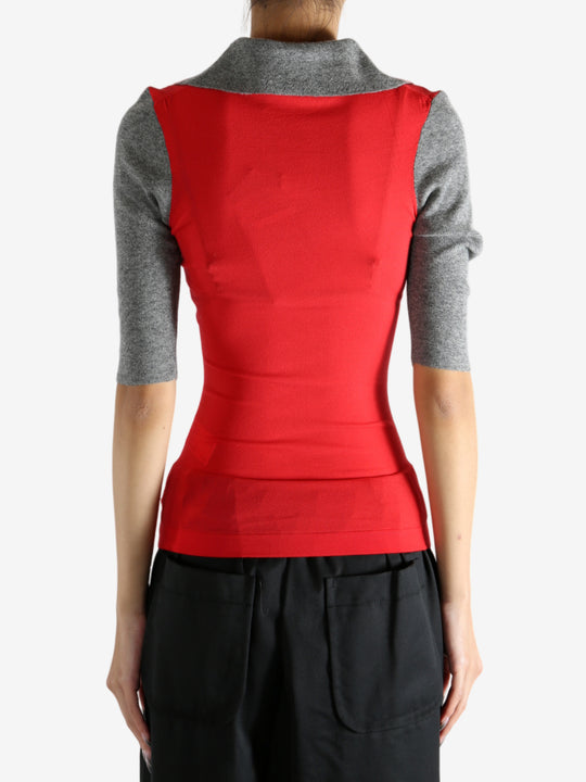 Red knitwear worn by a person, showing the knitwear's fit