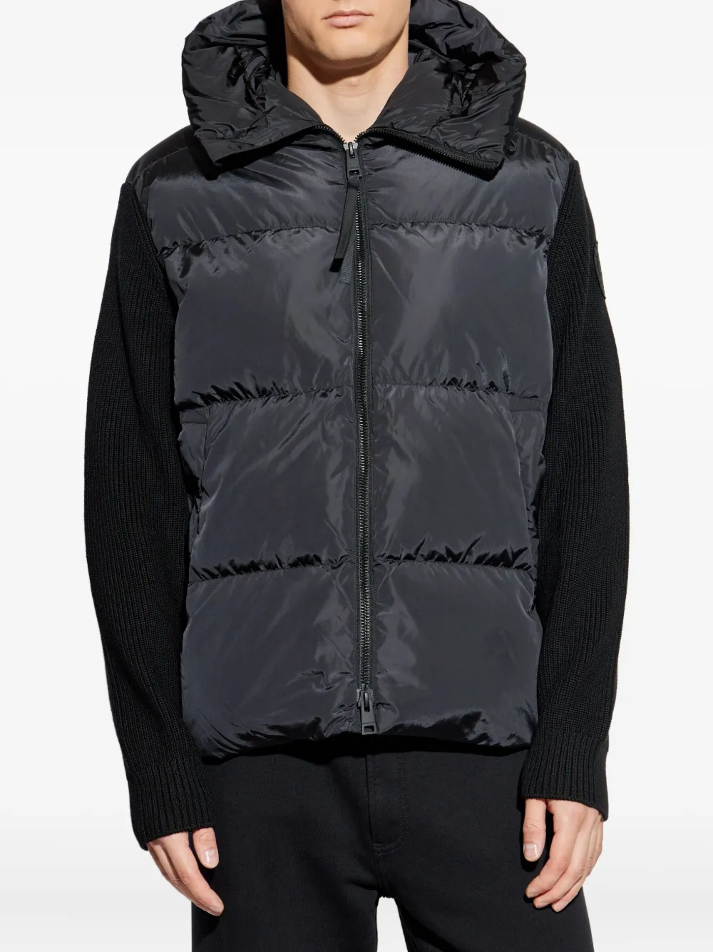 Black hoodie worn by a person, showing the hoodie's fit
