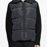Black hoodie worn by a person, showing the hoodie's fit