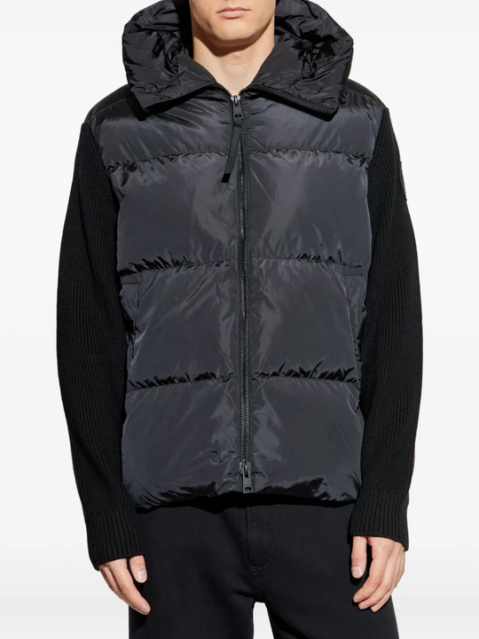 Black hoodie worn by a person, showing the hoodie's fit