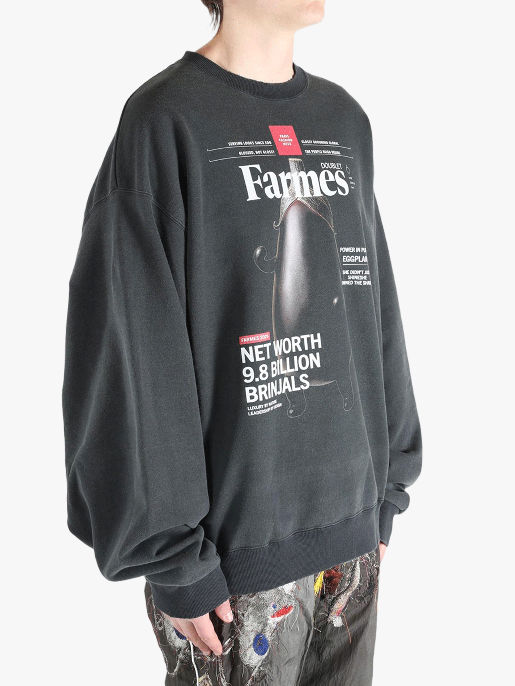 Black shirt worn by a person, showing the shirt's fit