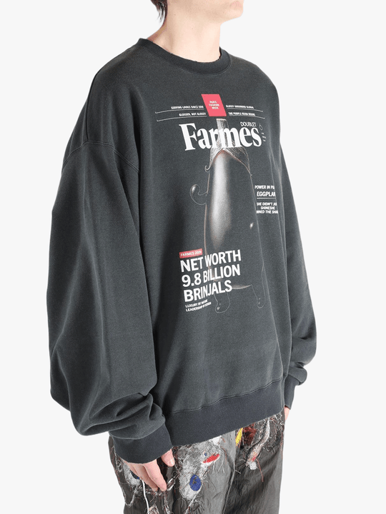 Black shirt worn by a person, showing the shirt's fit