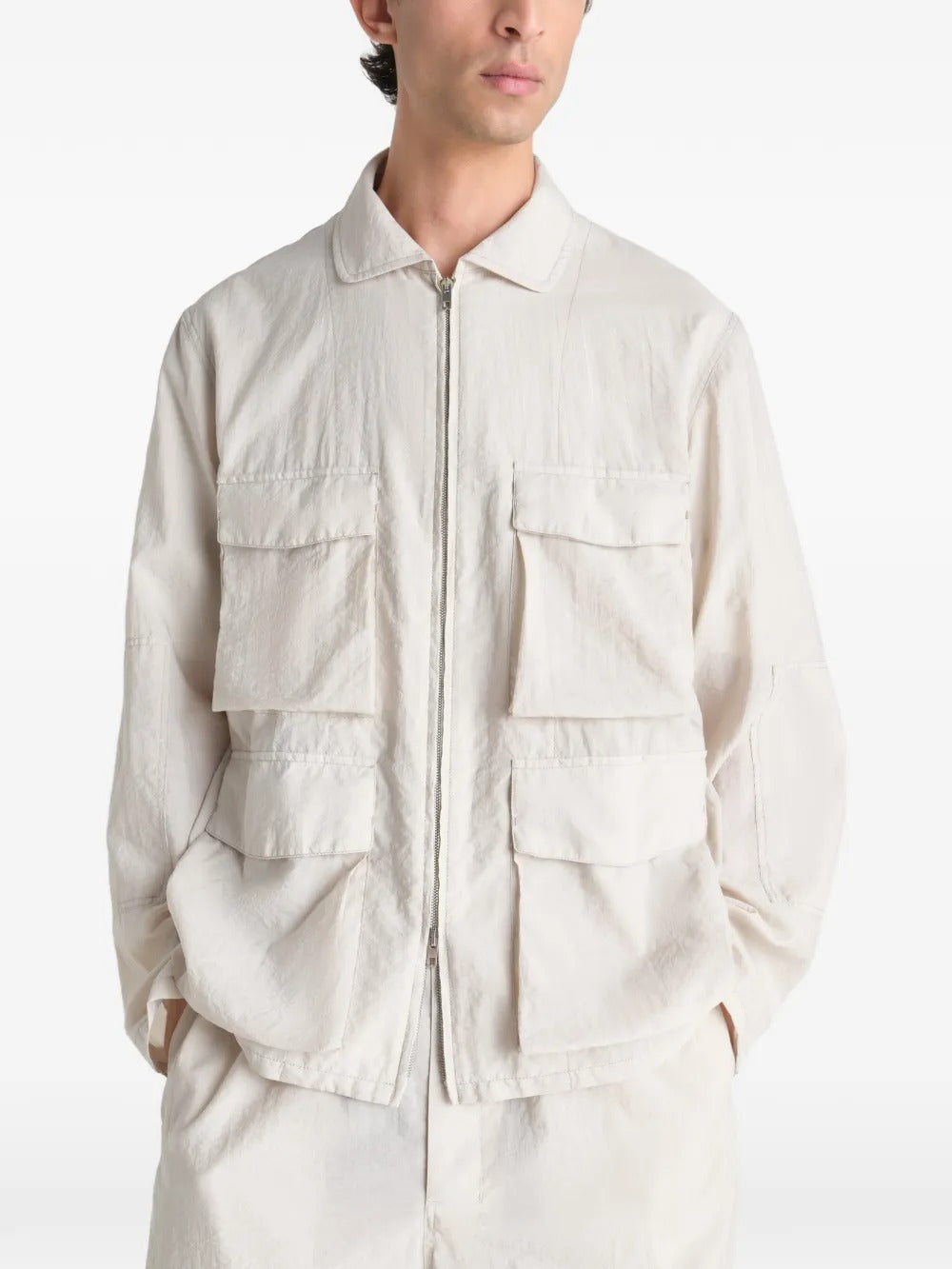 White jacket worn by a person, showing the jacket's fit