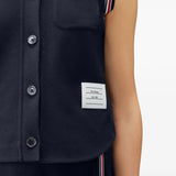 Navy shirt worn by a person, showing the shirt fit