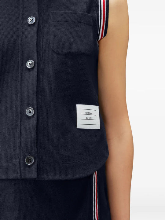 Navy shirt worn by a person, showing the shirt fit