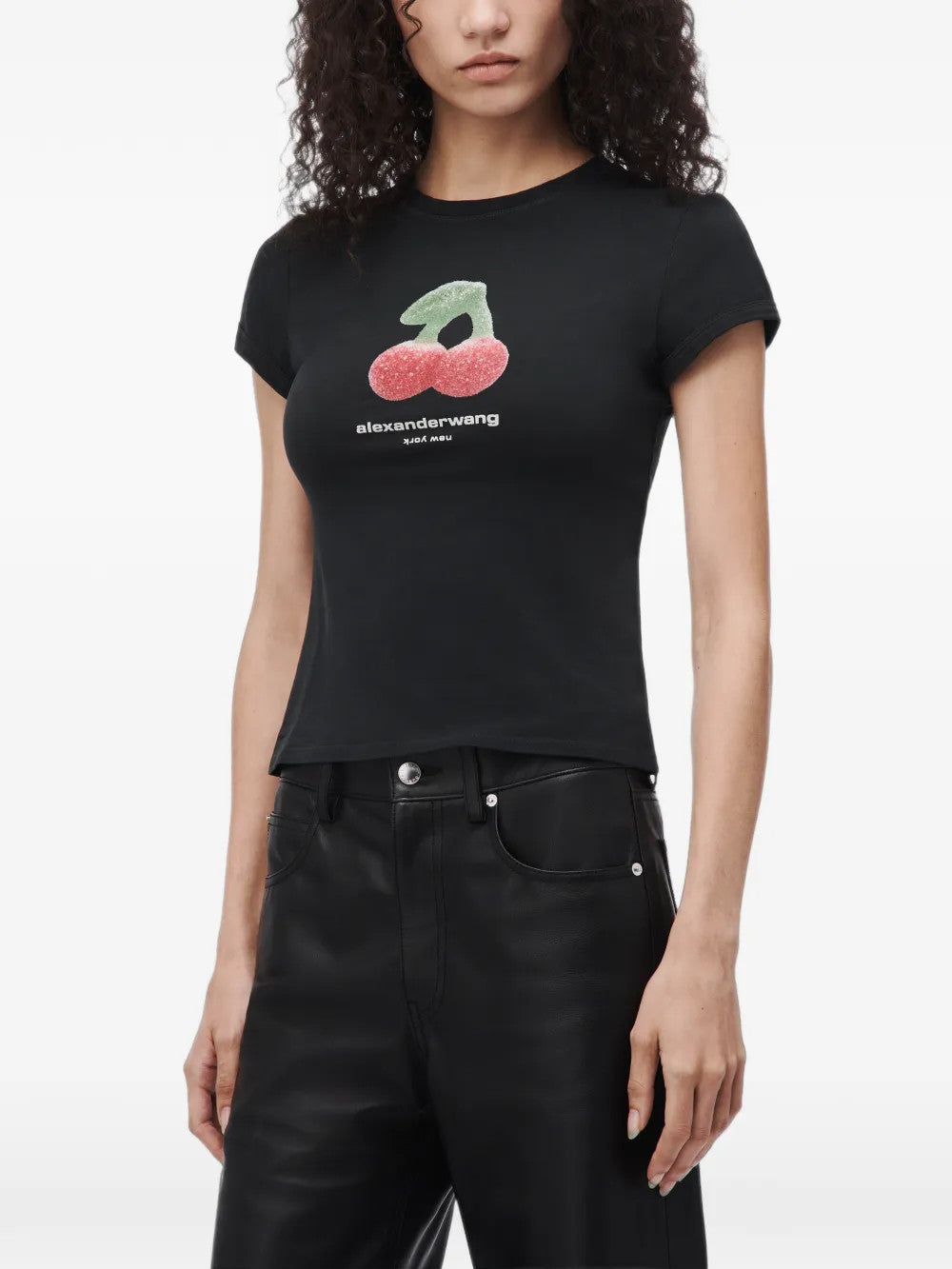 Black t-shirt worn by a person, showing the t-shirt fit