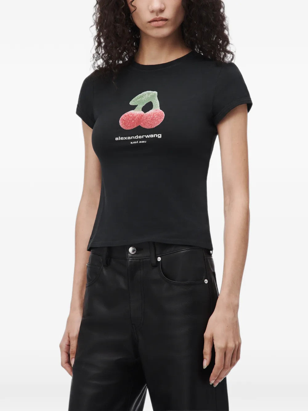 Black t-shirt worn by a person, showing the t-shirt fit