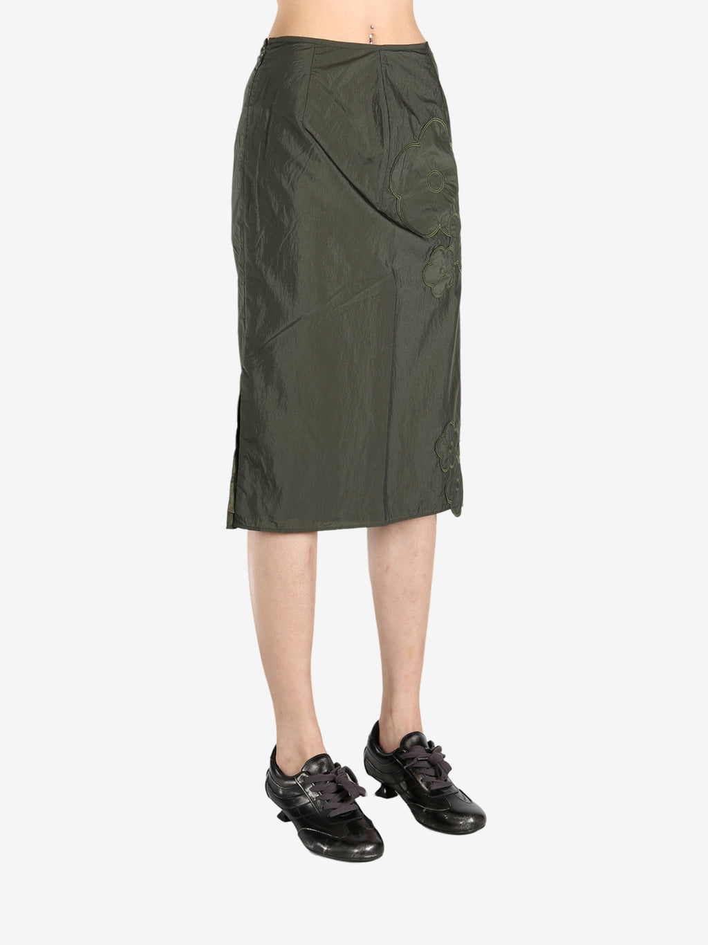 Green skirts worn by a person, showing the skirts fit