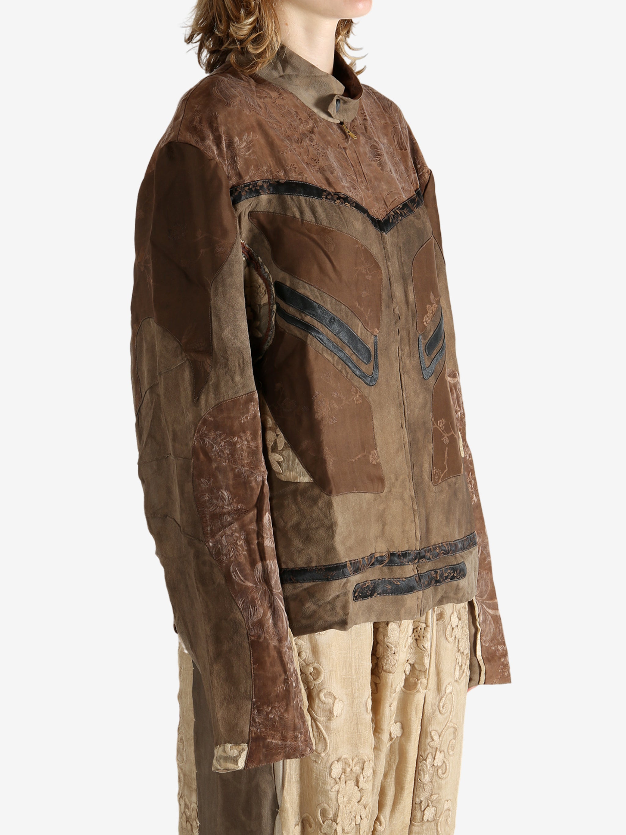 Brown jacket worn by a person, showing the jacket fit