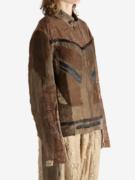 Brown jacket worn by a person, showing the jacket fit