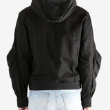 Black jacket worn by a person, showing the jacket's fit