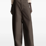 Brown pant worn by a person, showing the pant's fit