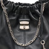 Close up of  black bag, showing texture of the leather fabric