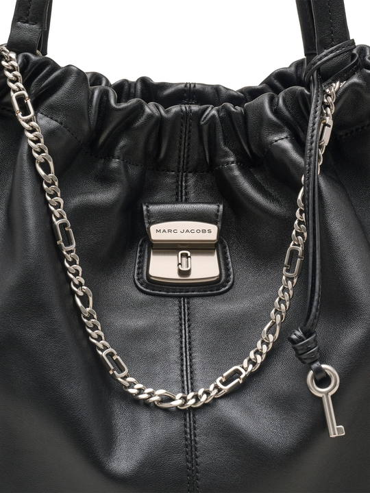 Close up of  black bag, showing texture of the leather fabric