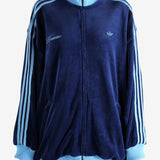 Blue jacket worn by a person, showing the jacket's fit