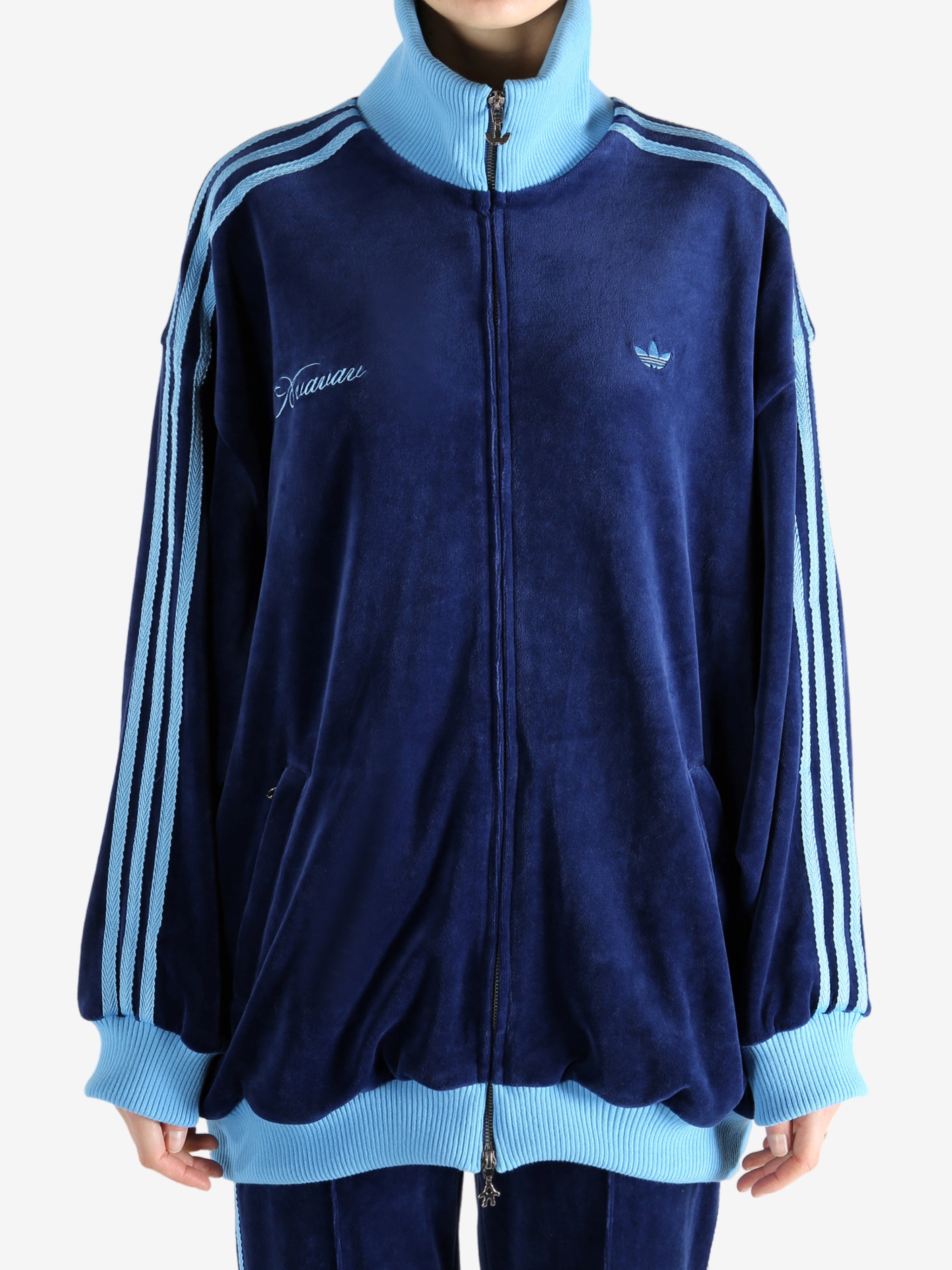 Blue jacket worn by a person, showing the jacket's fit