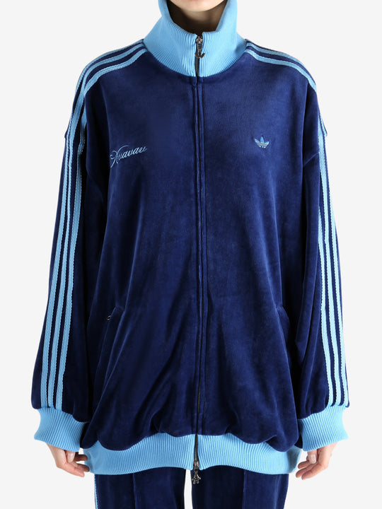 Blue jacket worn by a person, showing the jacket's fit