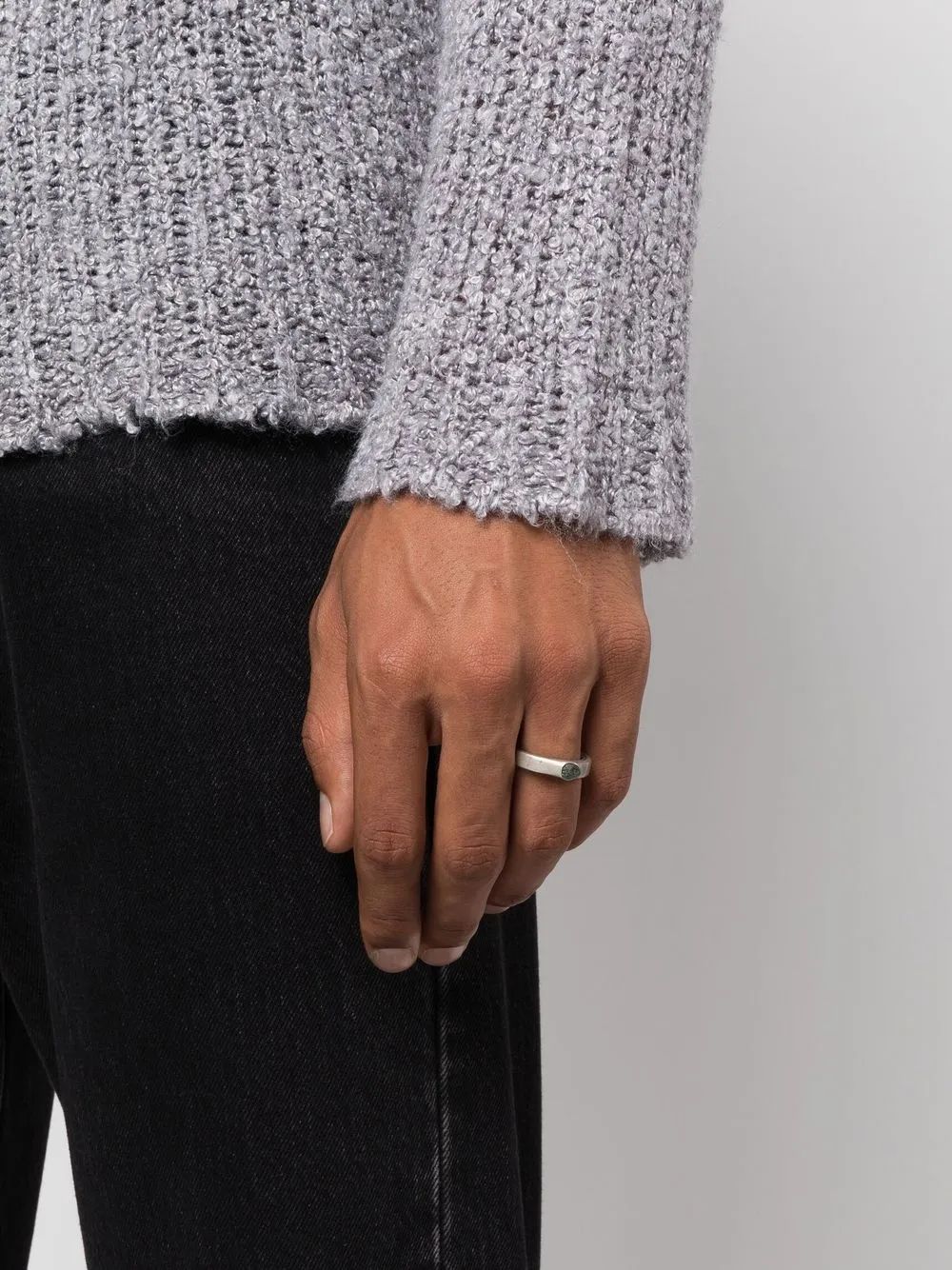 Grey rings worn by a person, showing the rings fit
