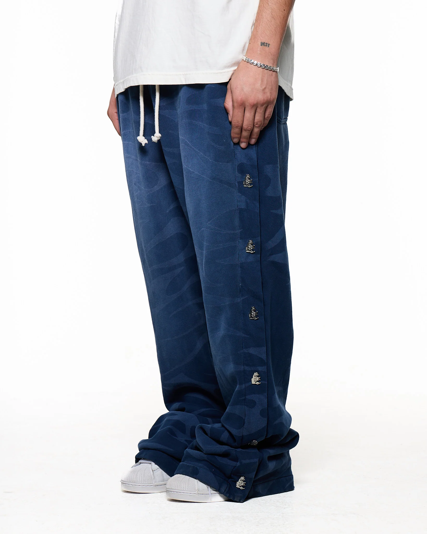 Black pants worn by a person, showing the pants fit