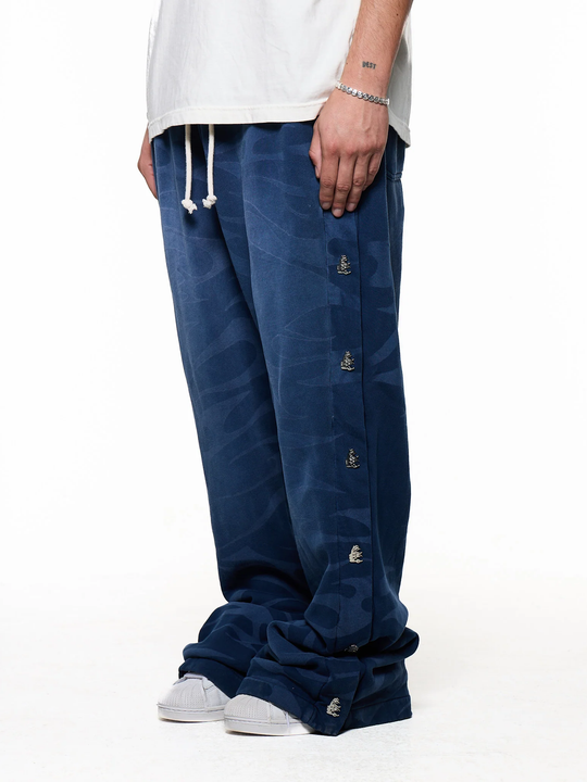 Black pants worn by a person, showing the pants fit