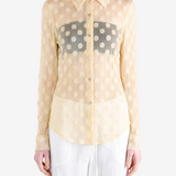 Tan shirt worn by a person, showing the shirt fit