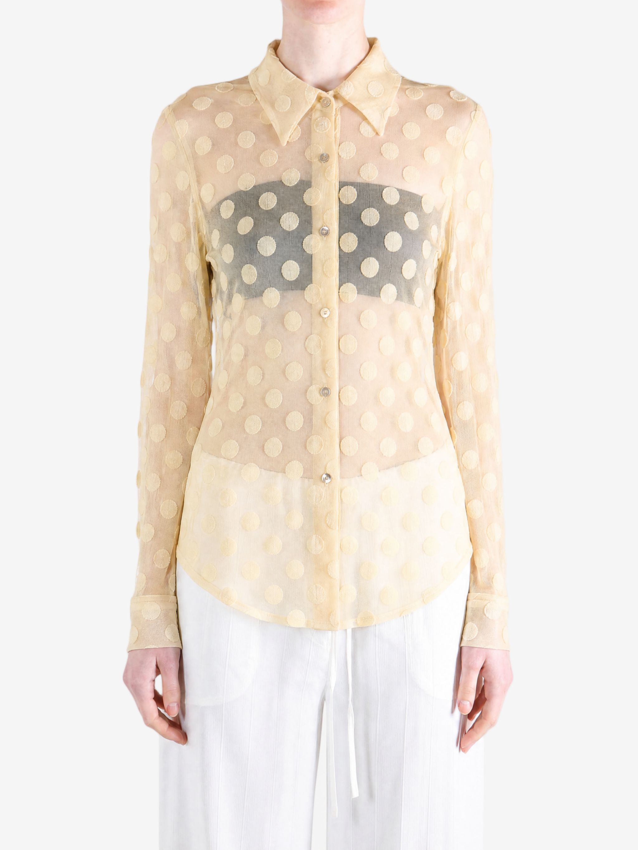 Tan shirt worn by a person, showing the shirt fit