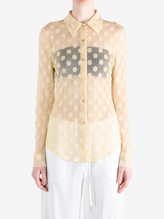 Tan shirt worn by a person, showing the shirt fit