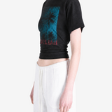 Black top worn by a person, showing the top fit