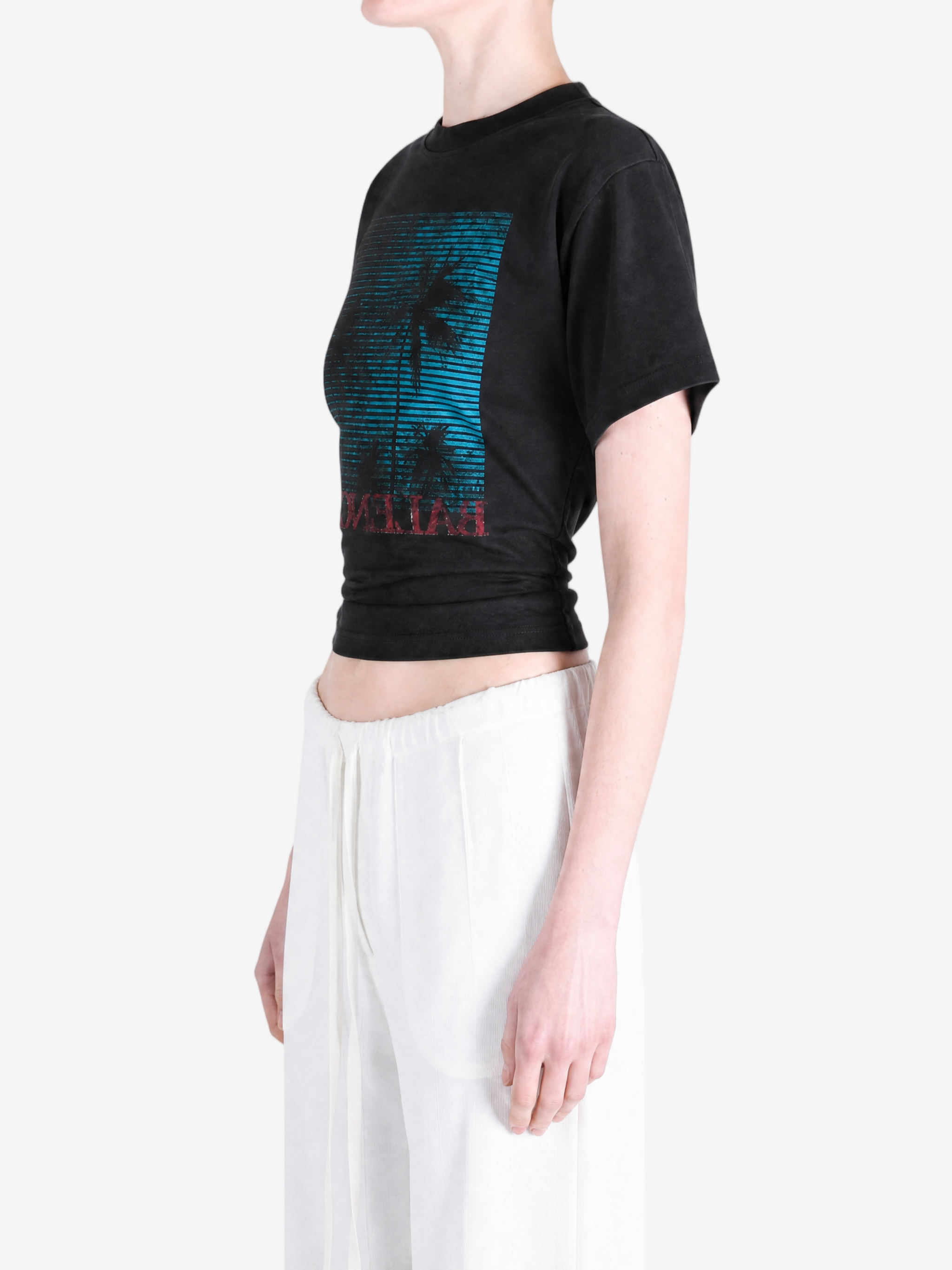Black top worn by a person, showing the top fit