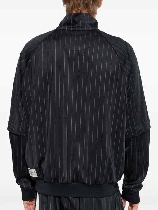 black jackets-coats worn by a person, showing the  jackets-coats fit