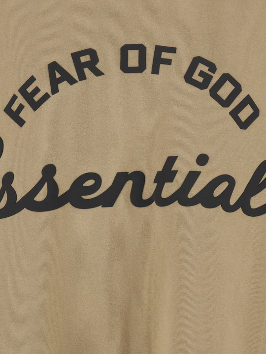 Close up of tan t-shirt, showing texture of the cotton fabric
