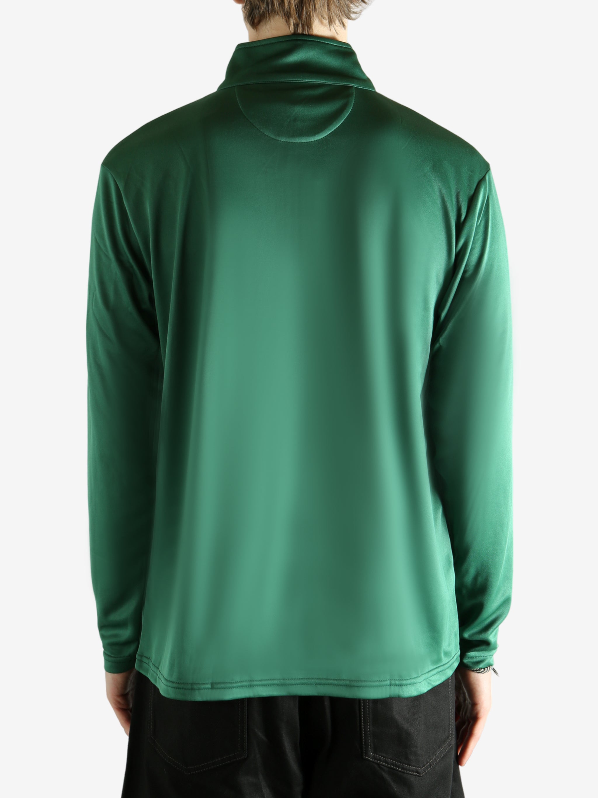 Green pullover worn by a person, showing the pullover's fit