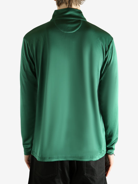 Green pullover worn by a person, showing the pullover's fit