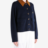 Navy knitwear worn by a person, showing the knitwear fit