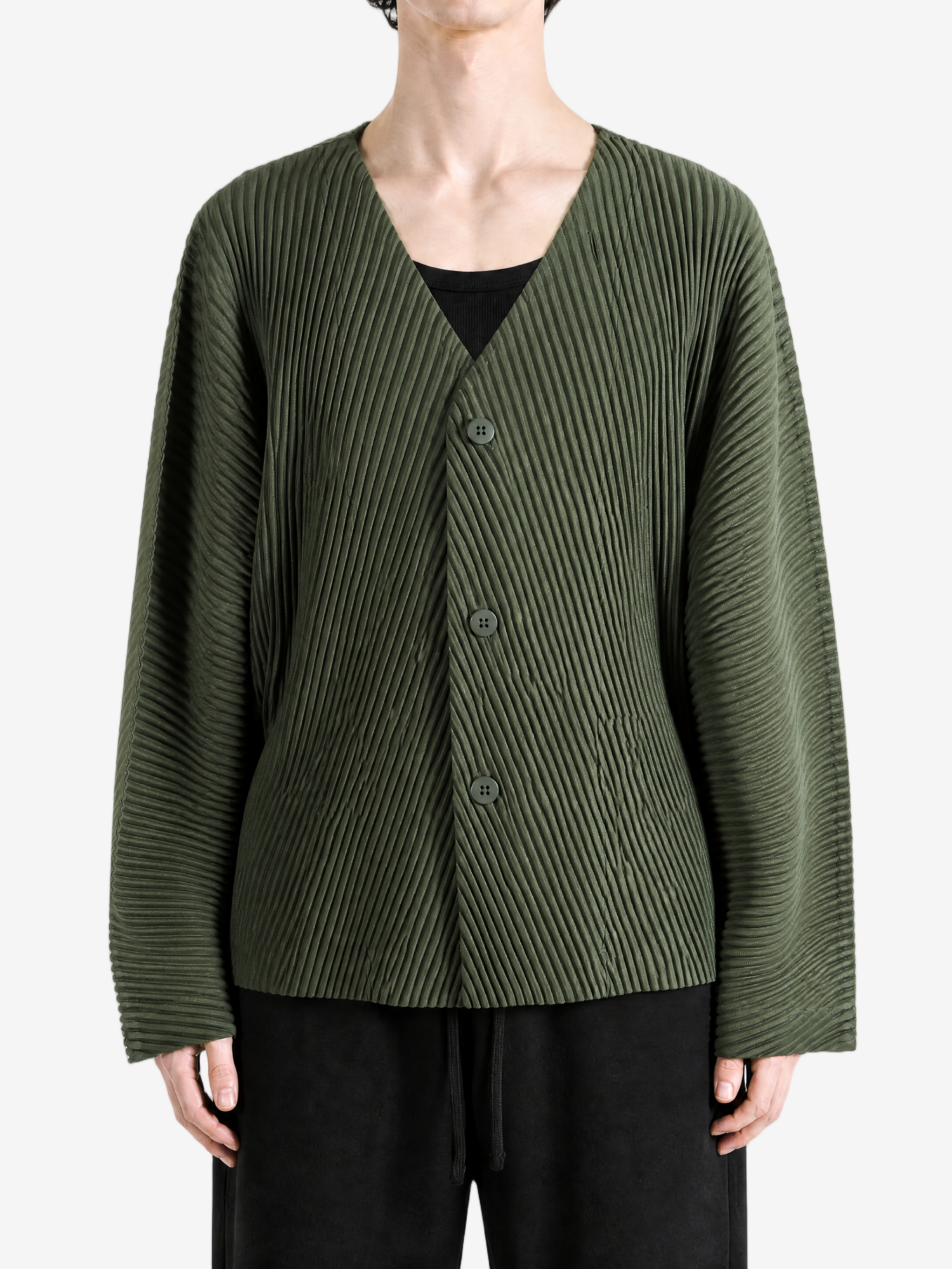 Green jacket worn by a person, showing the jacket fit