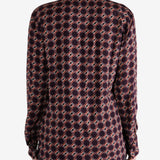 Red shirt worn by a person, showing the shirt fit