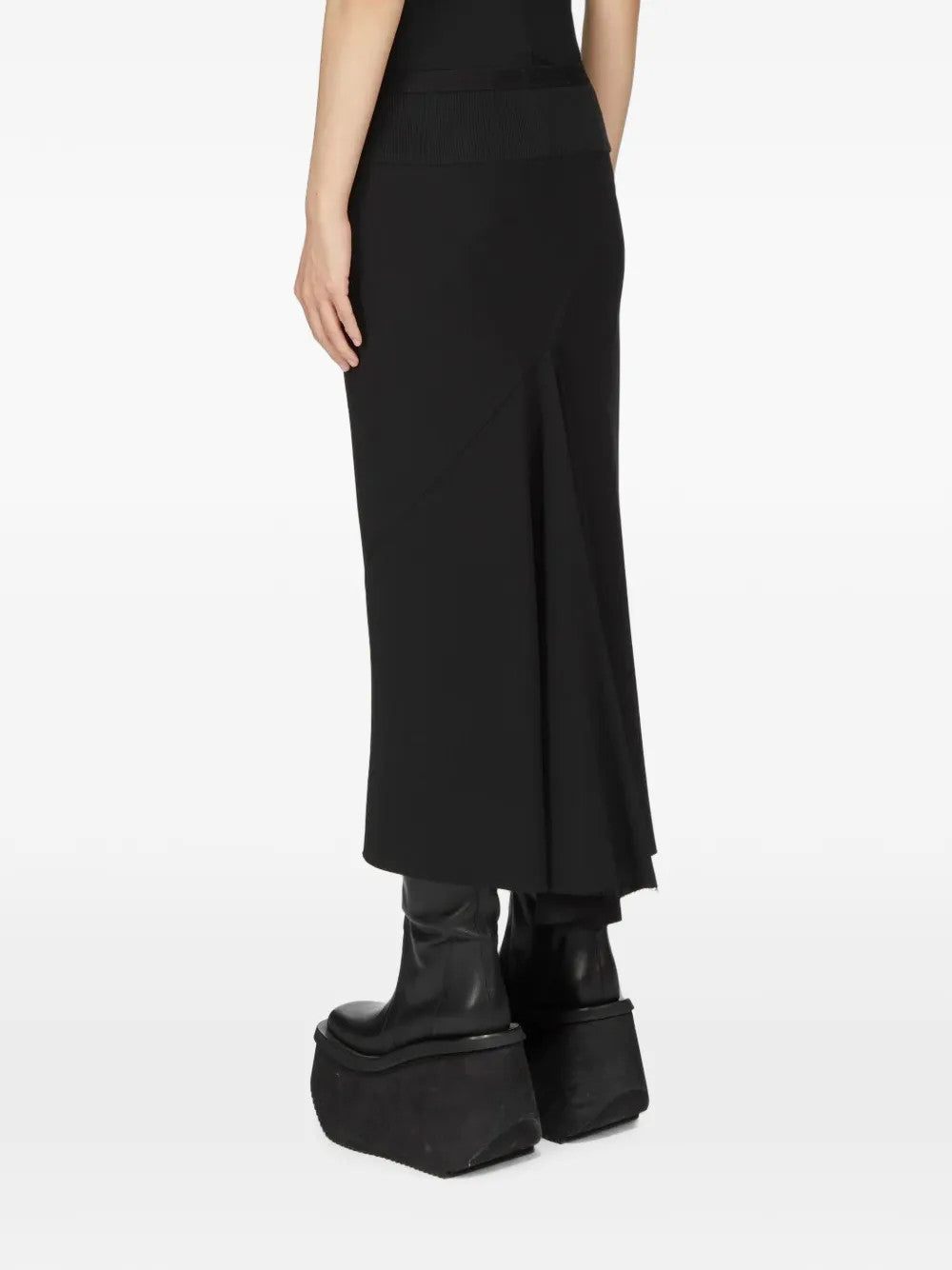Black skirt worn by a person, showing the skirt fit