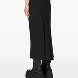 Black skirt worn by a person, showing the skirt fit