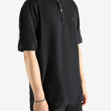 Black T-shirt worn by a person, showing the T-shirt's fit